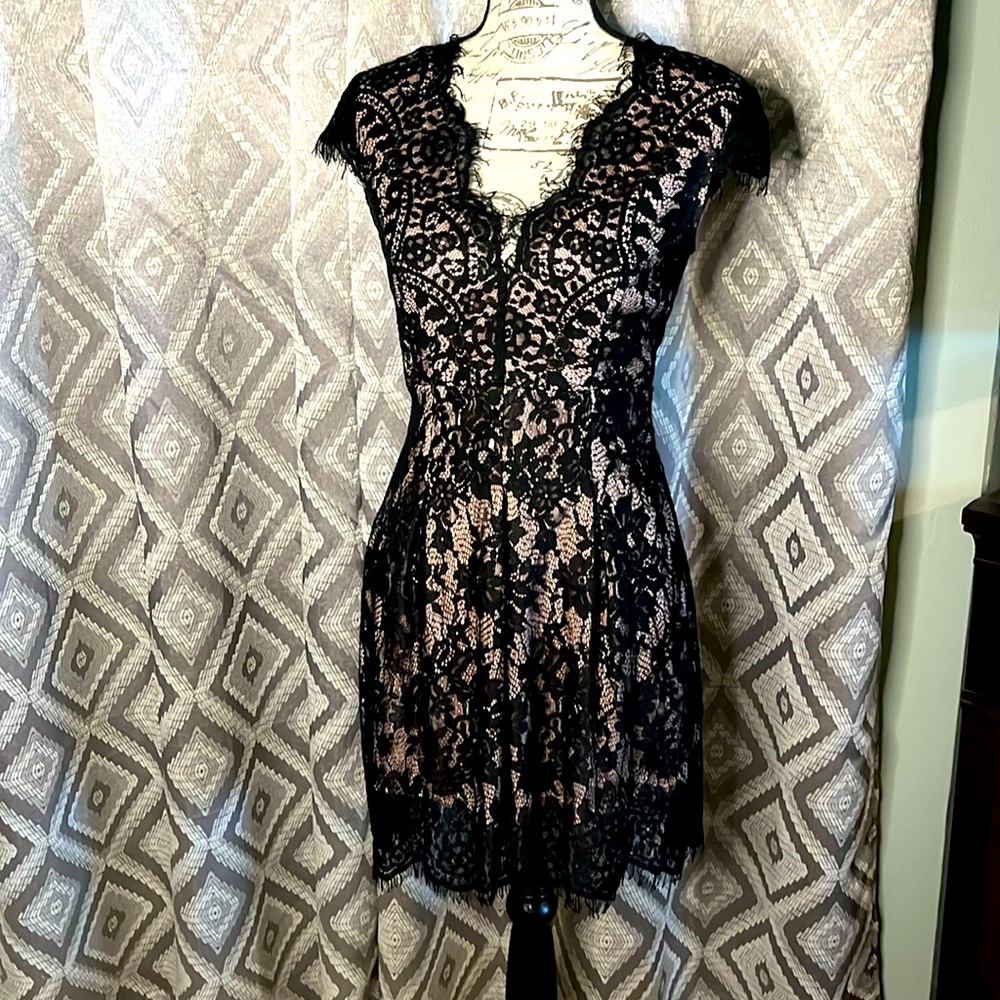 Black lace mini dress gently used With a hint of pink under the lace